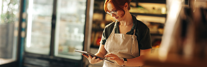 Woman on tablet in store