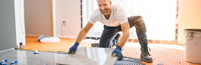 Man laying tile