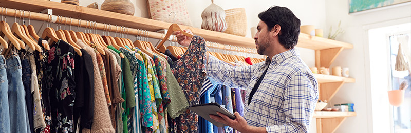 Man working in clothing store