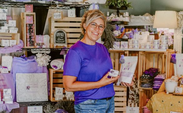 Woman posing with small business products
