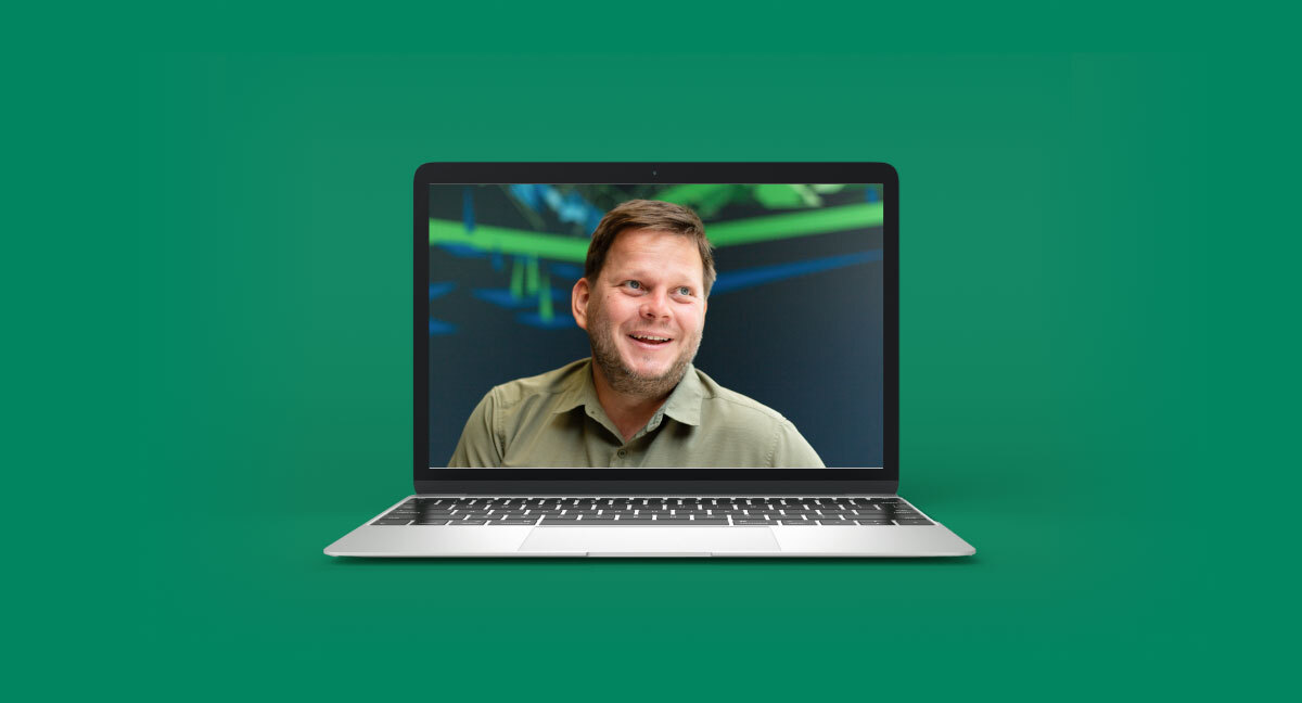 headshot of man on laptop display