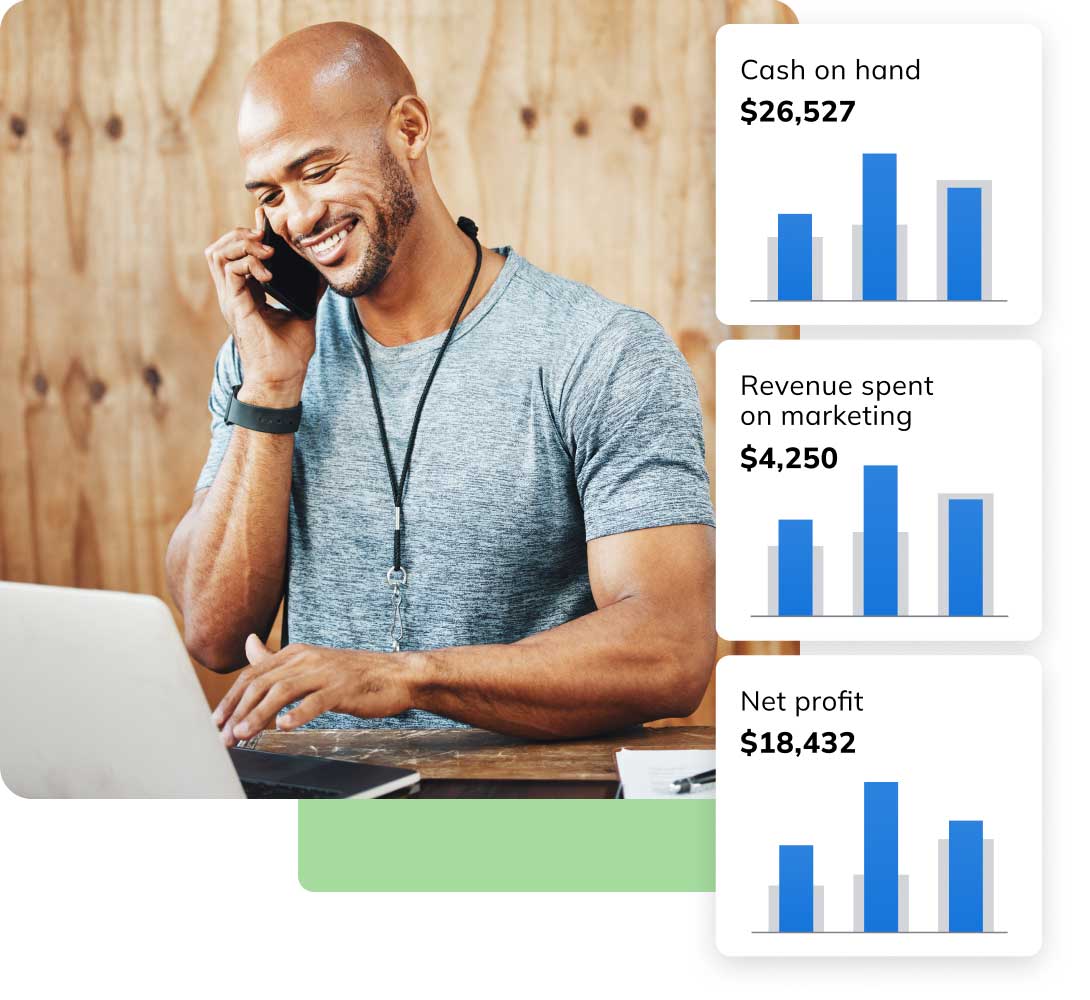 Man talking on phone and working on laptop with LivePlan graphics