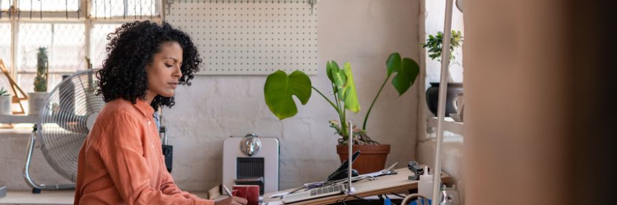 Woman working at drafting table