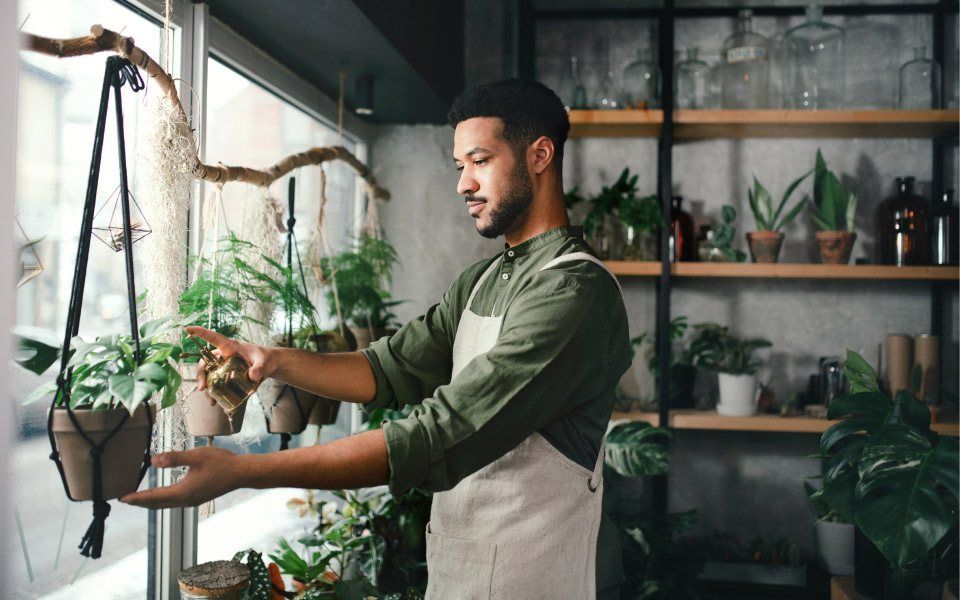 Man taking care of plants