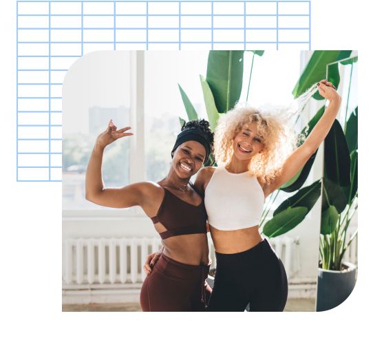 Two women posing in yoga gear
