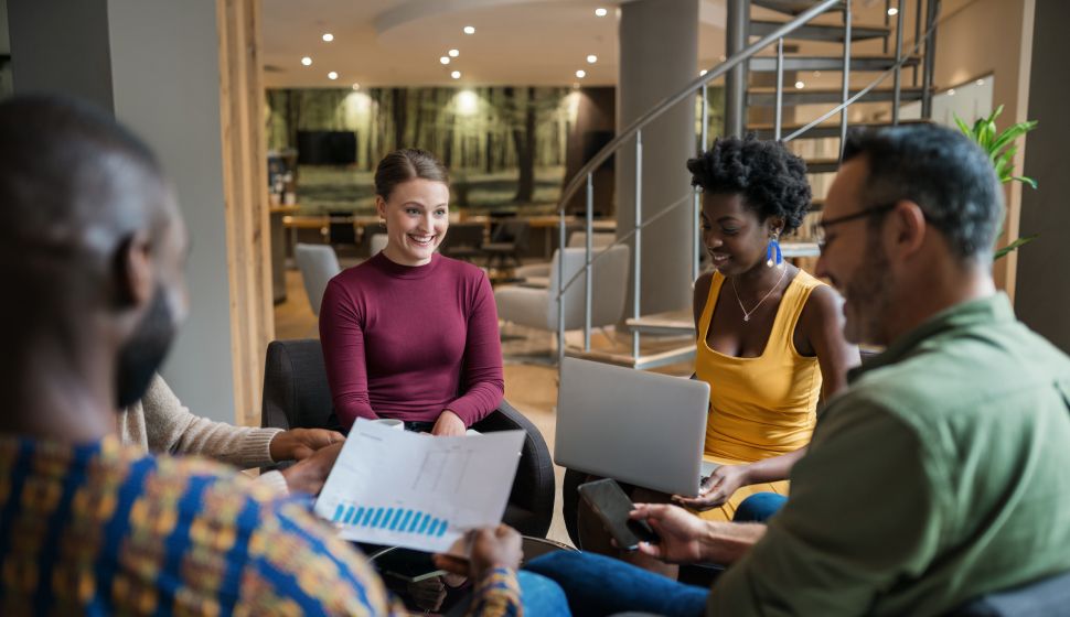 Group of people reviewing a document together