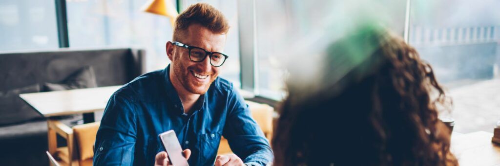 Two business partners discuss the difference of startups vs small businesses