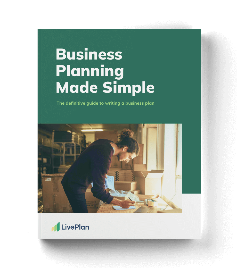 Cover of "Business Planning Made Simple" with a person writing at a desk, surrounded by shelves and boxes, by LivePlan.